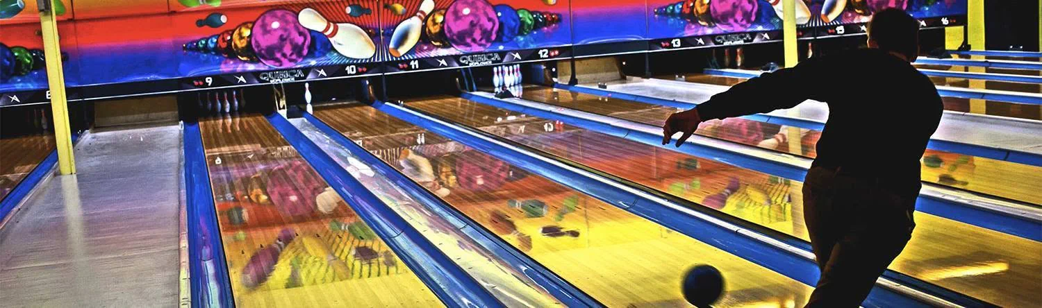 Bowler releasing a ball on the colorful lanes at Southern Lanes Bowling Green