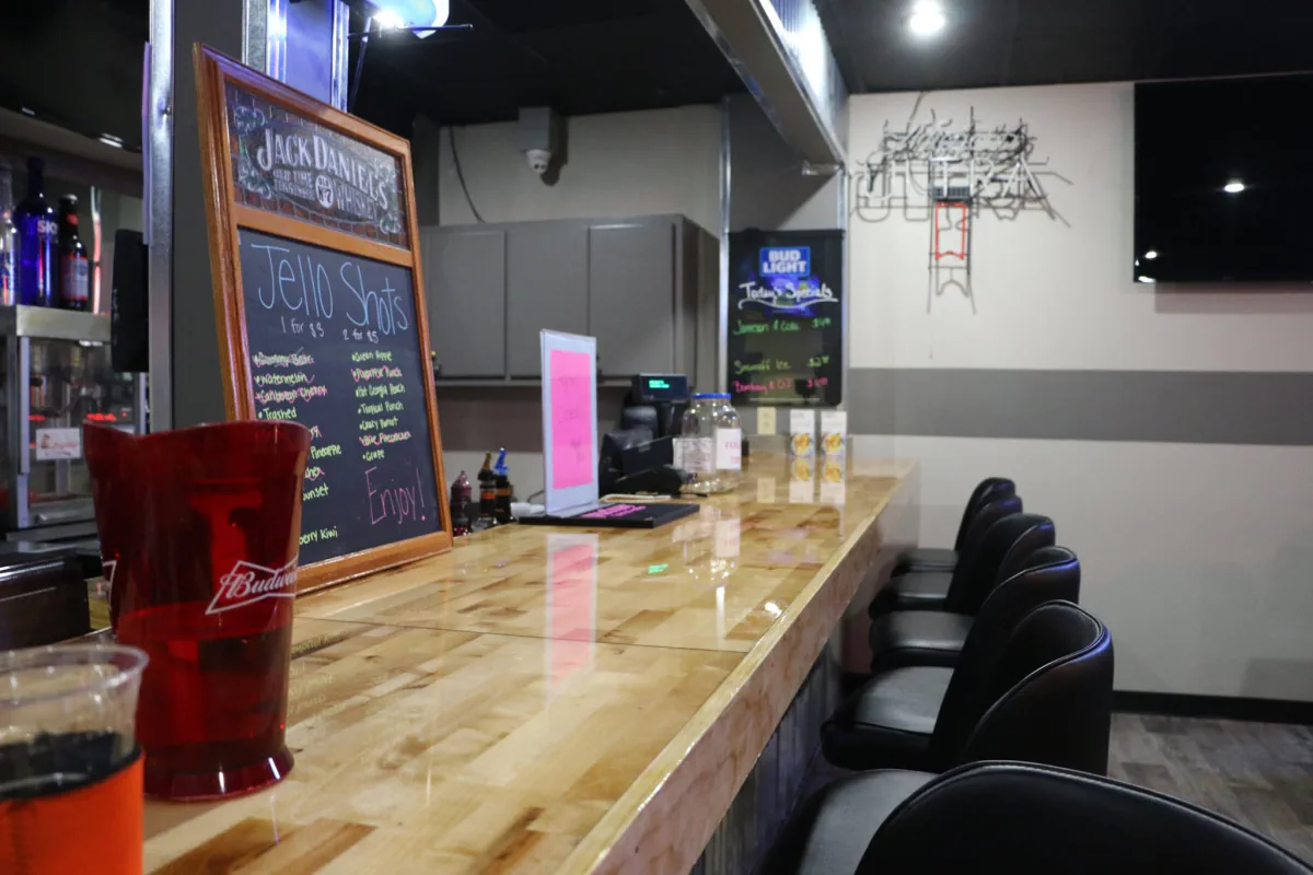 The wood bar and seating inside the Southern Lanes lounge